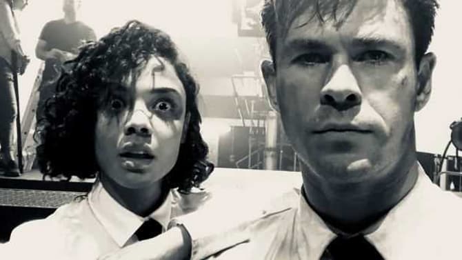 MEN IN BLACK: Tessa Thompson And Chris Hemsworth Become The &quot;Buds In Black&quot; In New Desert Set Photo