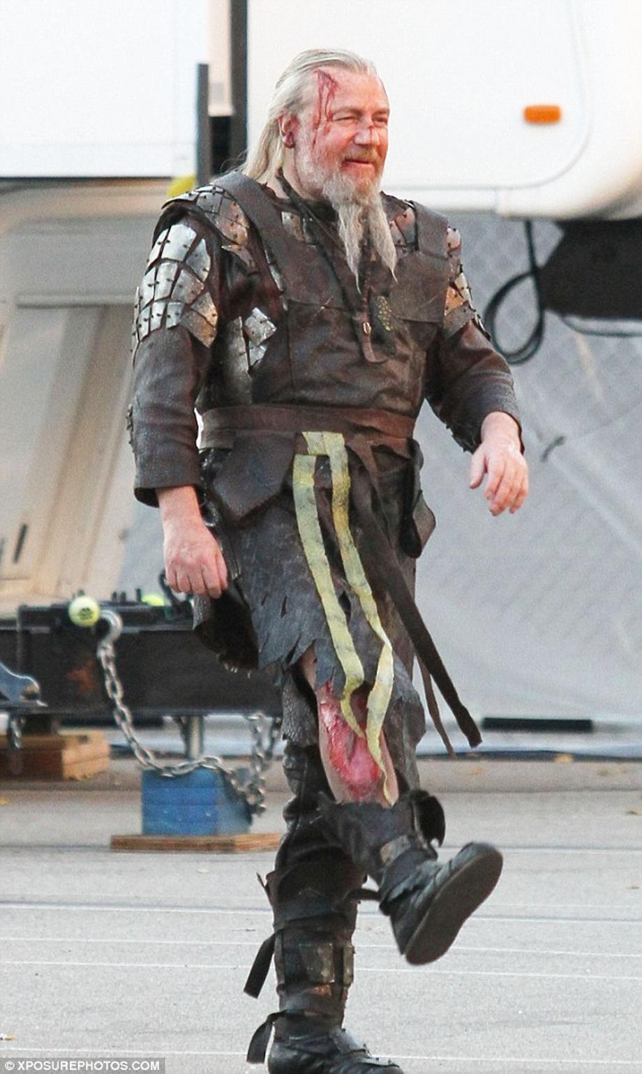 Limping around: Ray Winstone appears on set of new film Noah, sporting a massive fake bloody leg wound