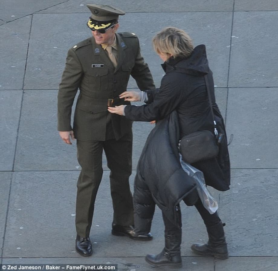 Wardrobe to the rescue: An assistant seemed to be giving the actor's military uniform a last-minute tweak as he prepared to shoot new scenes for the movie 