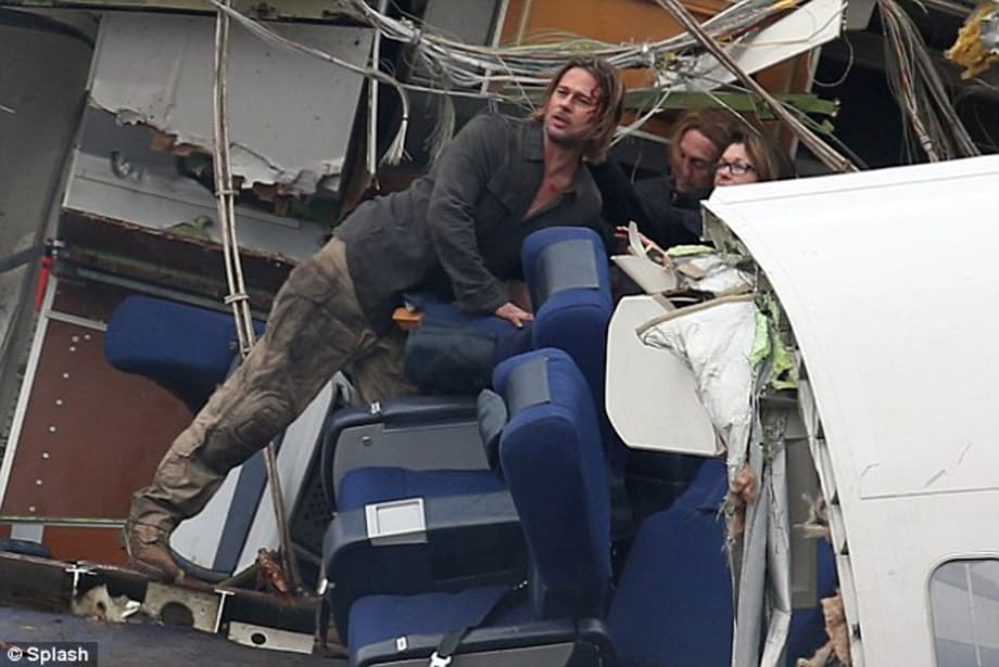 Crash and burn: Brad Pitt is left with a bloody face in plane crash scenes he filmed for World War Z in Berkshire, England a few days ago 