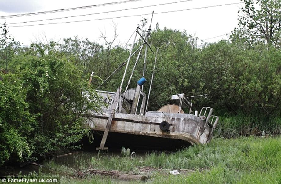 Haunting: A fishing boat lies abandoned in the Japanese fishing village recreated for the filming of a new Godzilla movie in Canada