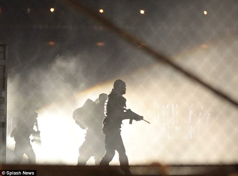 In action: Across the fence from Megan the characters were staging a fight scene