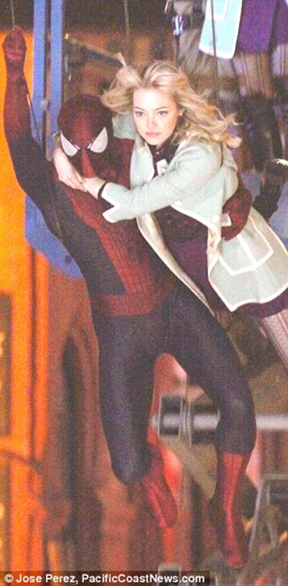 High wire act: The wires holding the pair aloft are clearly visible in the shot 