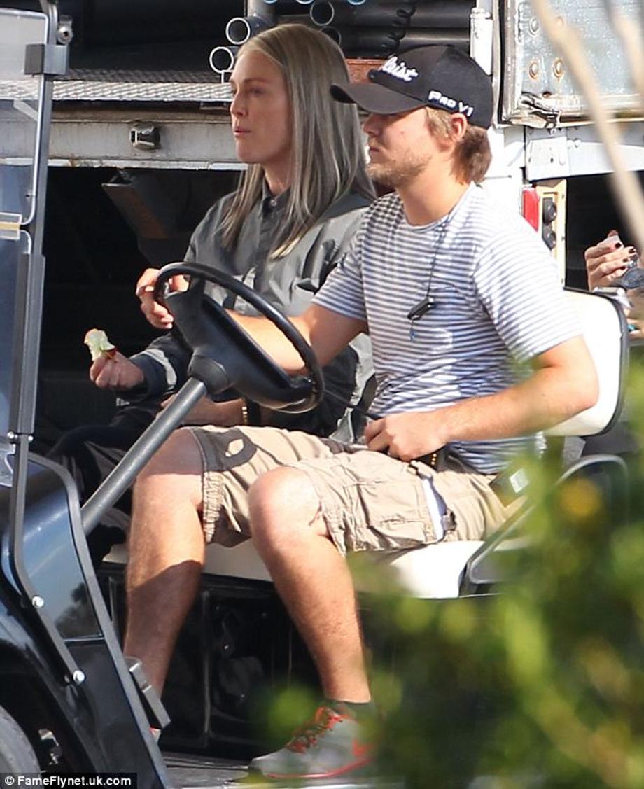 Hungry? Julianne Moore eats an apple on the set of The Hunger Games: Mockingjay Part 1