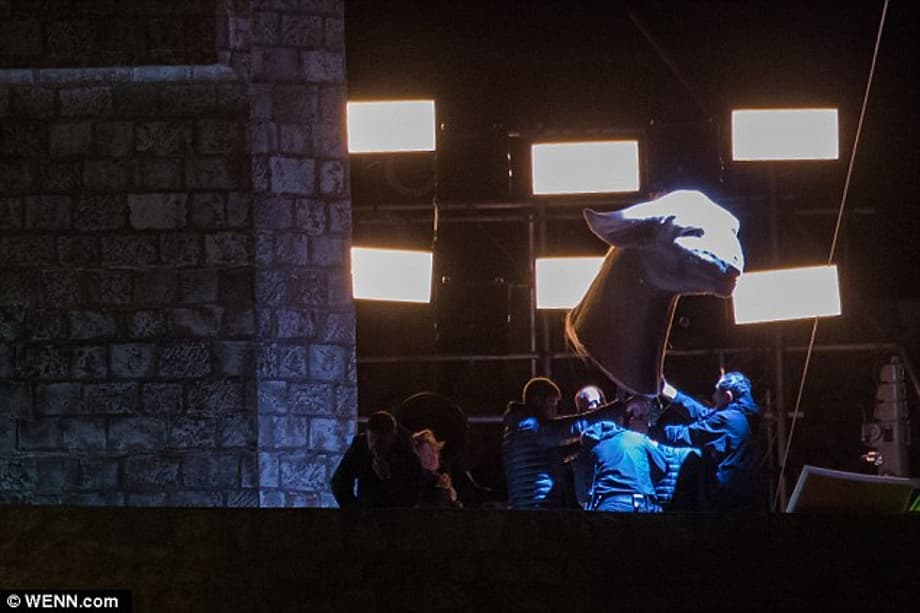 Monster mayhem: Members of the crew were also seen hoisting a huge feline-like head up into the air in front of a green-screen after the sun had set