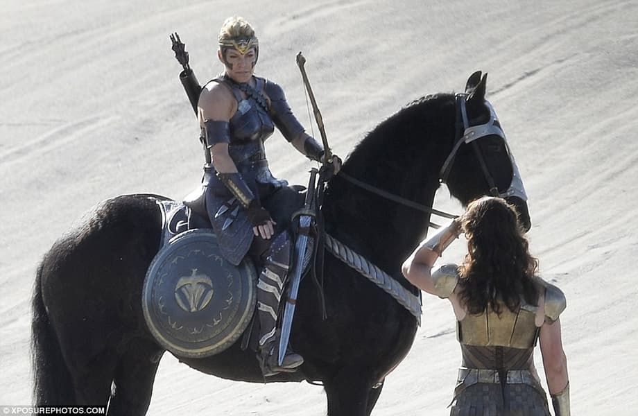 Moving on: Further scenes saw her sporting perfectly styled curly hair as she talked to a fellow co-star who sat upon a horse