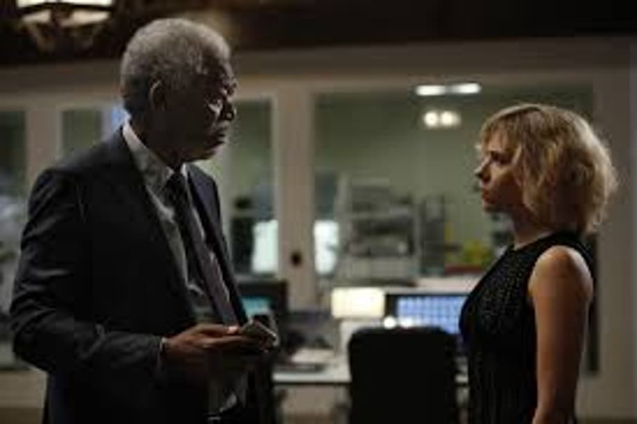 Morgan Freeman as Prof. Norman and Scarlett Johansson as Lucy