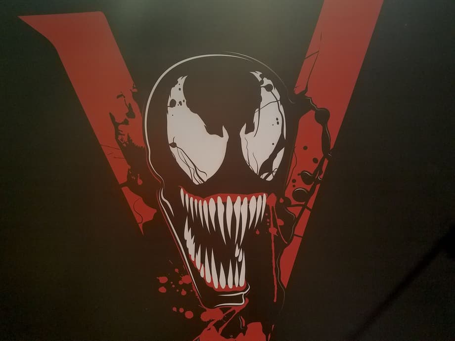 VENOM: New CCXP Banners Possibly Reveal The Film's Logo And Eddie Brock's Likely Costume