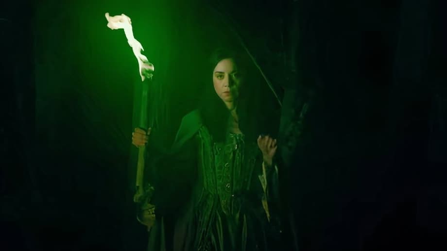 rio-vidal-holds-a-green-torch-in-a-forest-in-agatha-all-along-trailer