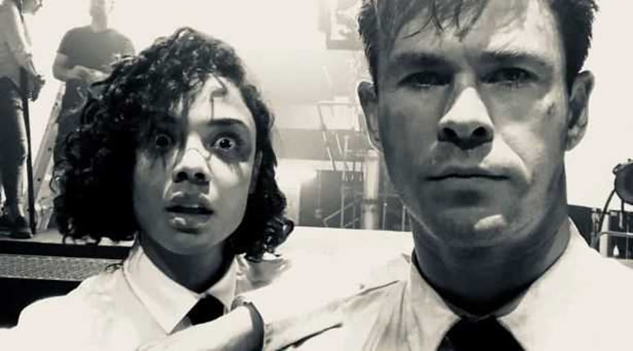 MEN IN BLACK: Tessa Thompson And Chris Hemsworth Become The &quot;Buds In Black&quot; In New Desert Set Photo