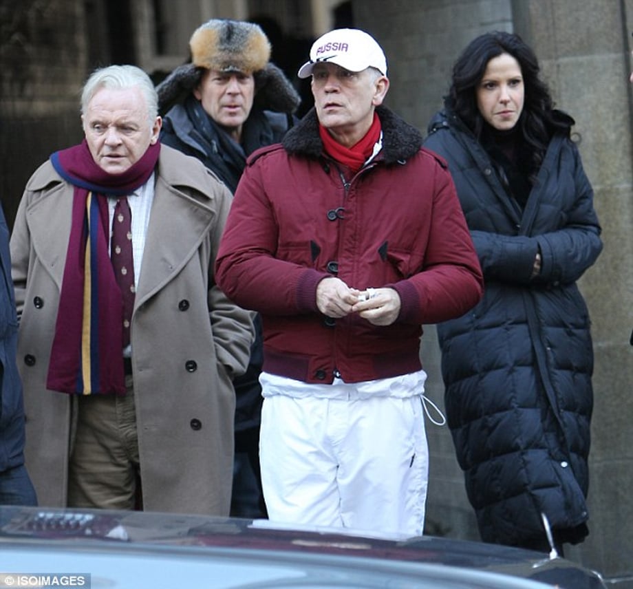 Pushing through: The trio were also joined by John Malkovich as they shot scenes for the upcoming movie
