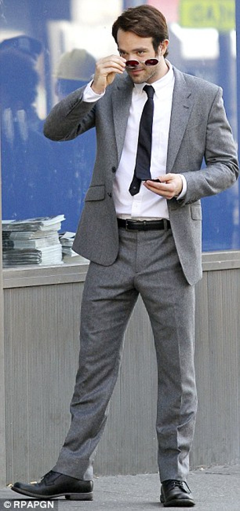 Suiting up: Charlie was appropriately dressed for a lawyer - but fans have to wait to see his red Daredevil outfit