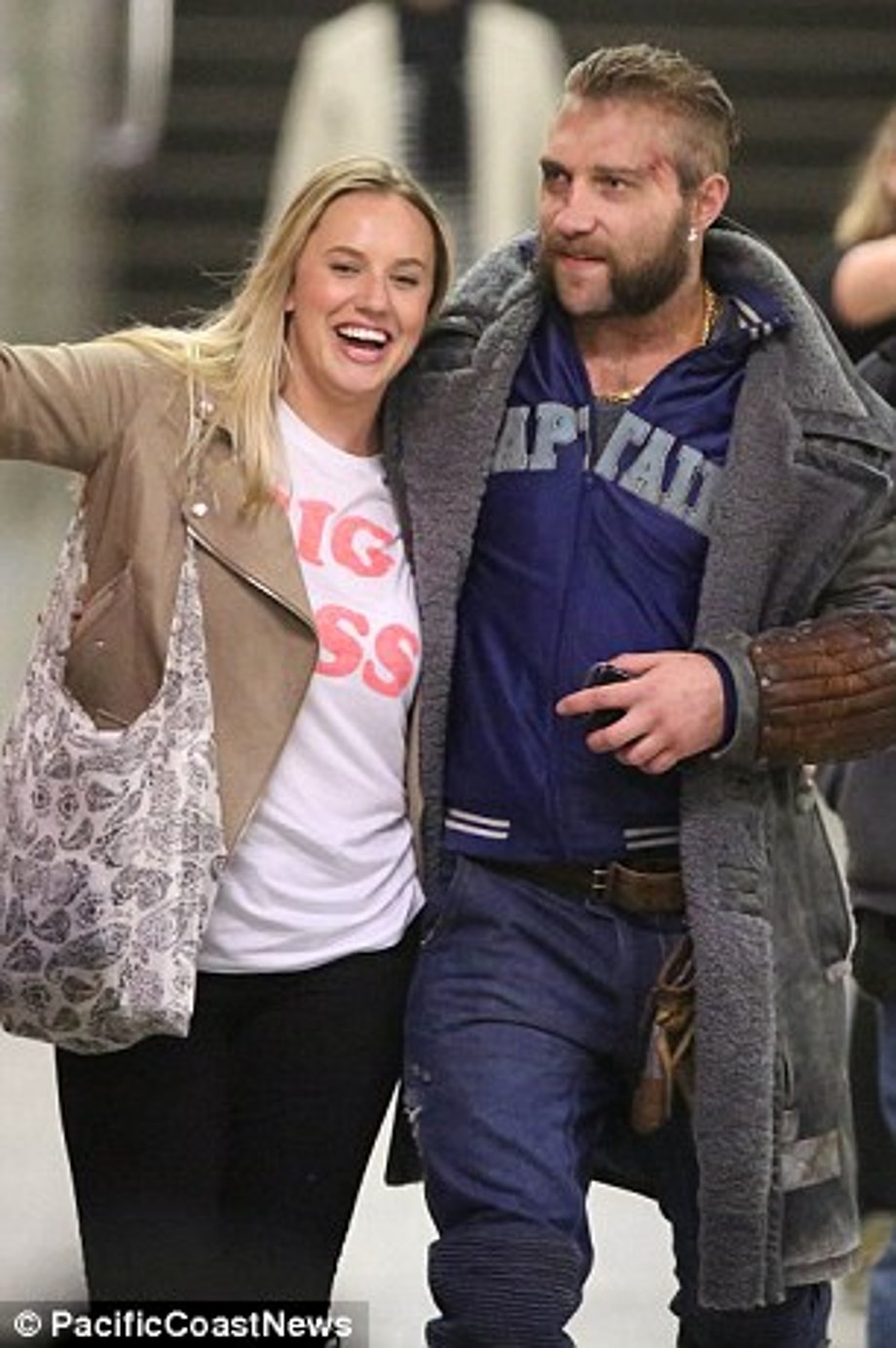 What's not to smile about? He was seen in high spirits, cuddling up to Margot Robbie's personal assistant and good friend
