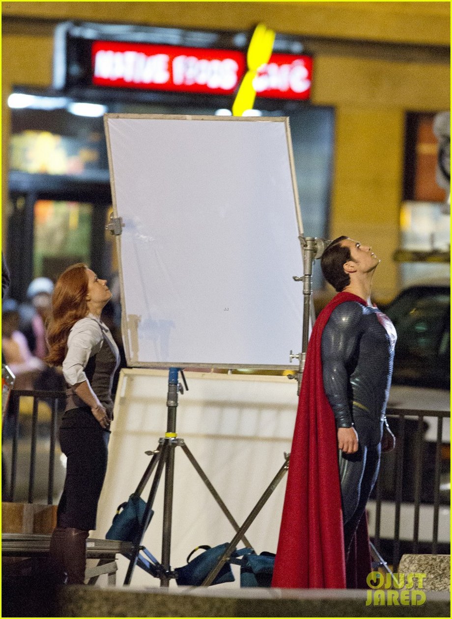 henry cavill hangs in the air in superman costume 01